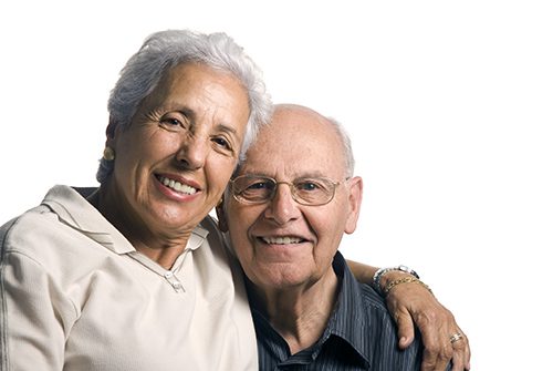 A man and woman are smiling for the camera.