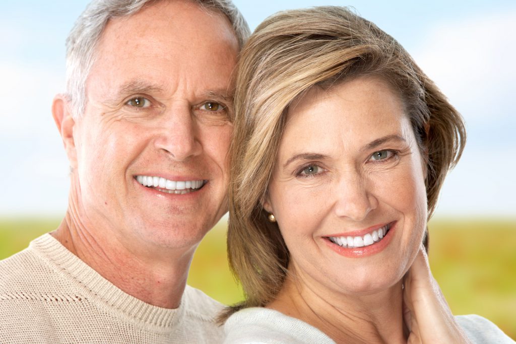 A man and woman smiling for the camera.