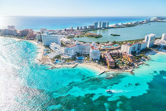 A view of the ocean and beach from above.