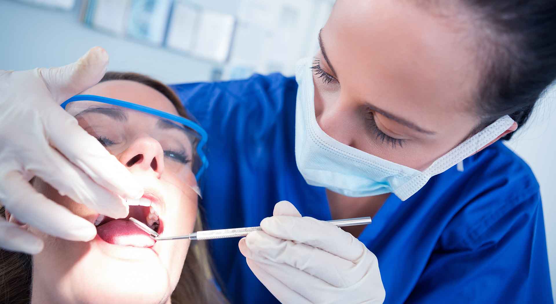 Dentist examining a patient in Los Algodones dental clinic