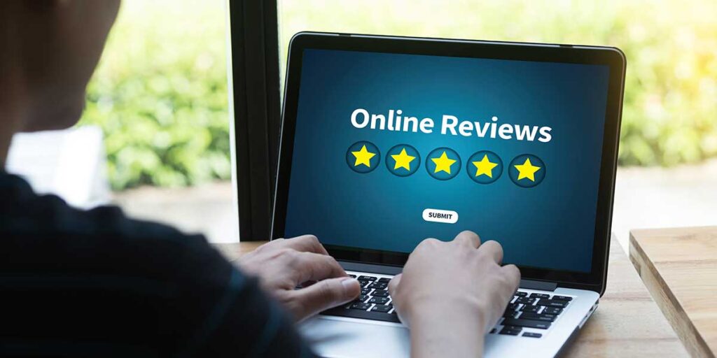 A person doing an online patient review for Beyond Borders Dental.